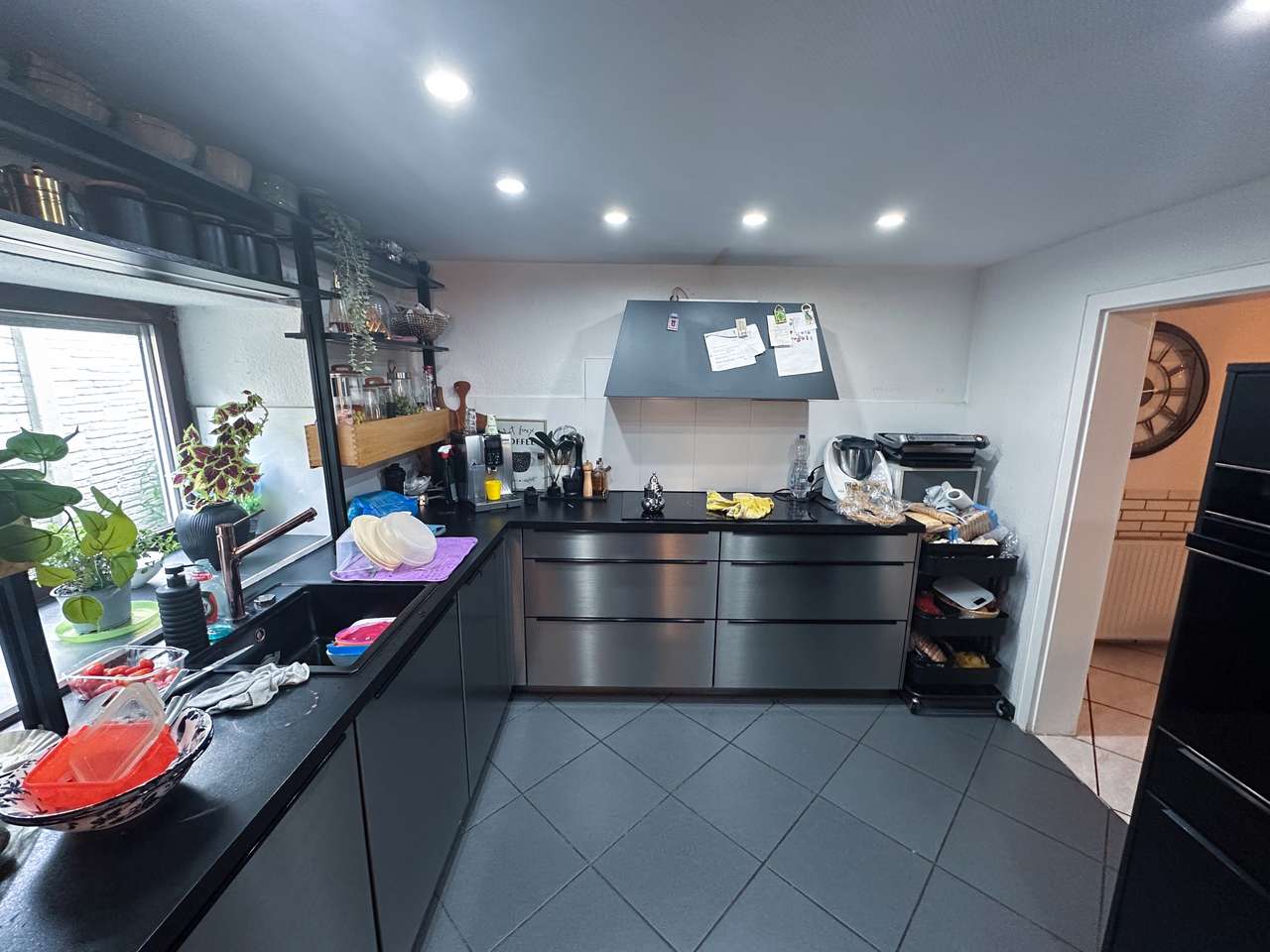 Vielseitiger Bungalow mit attraktivem Mietertrag in begehrter Lage von Düsseldorf